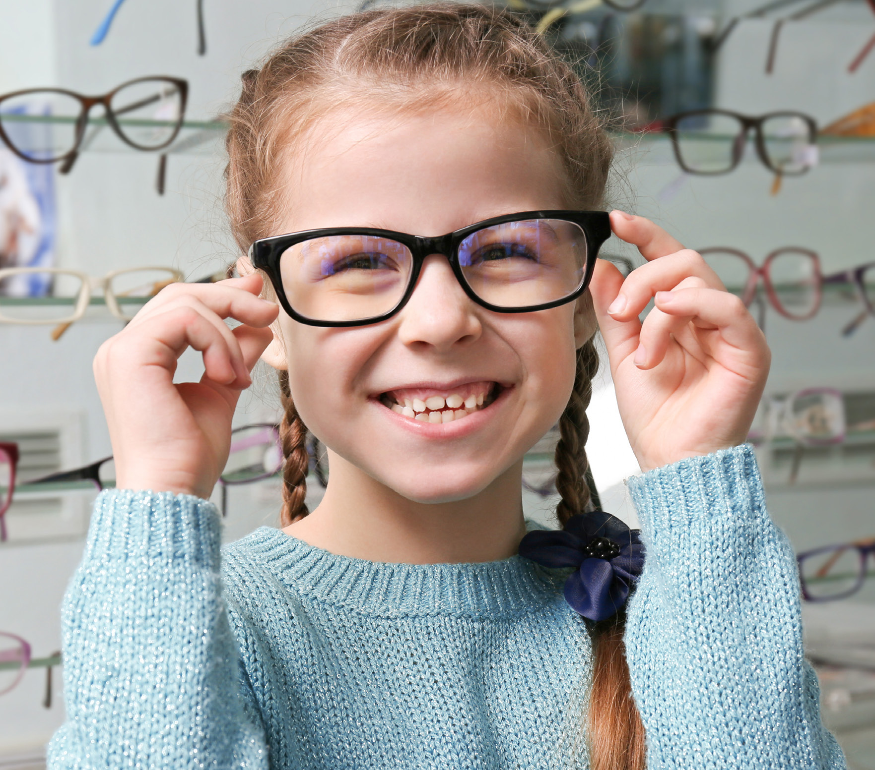 Child wearing spectacles for MiYOCLEAR childhood myopia management